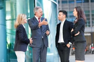 Group of business people talking outdoor in an urban setting